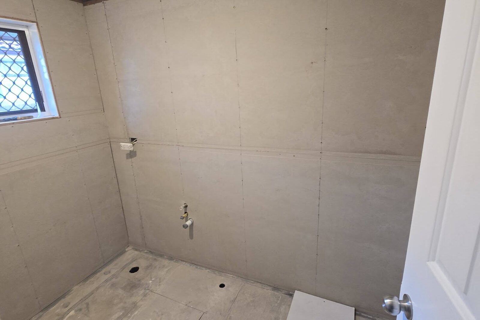 Bathroom floor screeded to falls and ready for waterproofing by SLJ Express Tiling