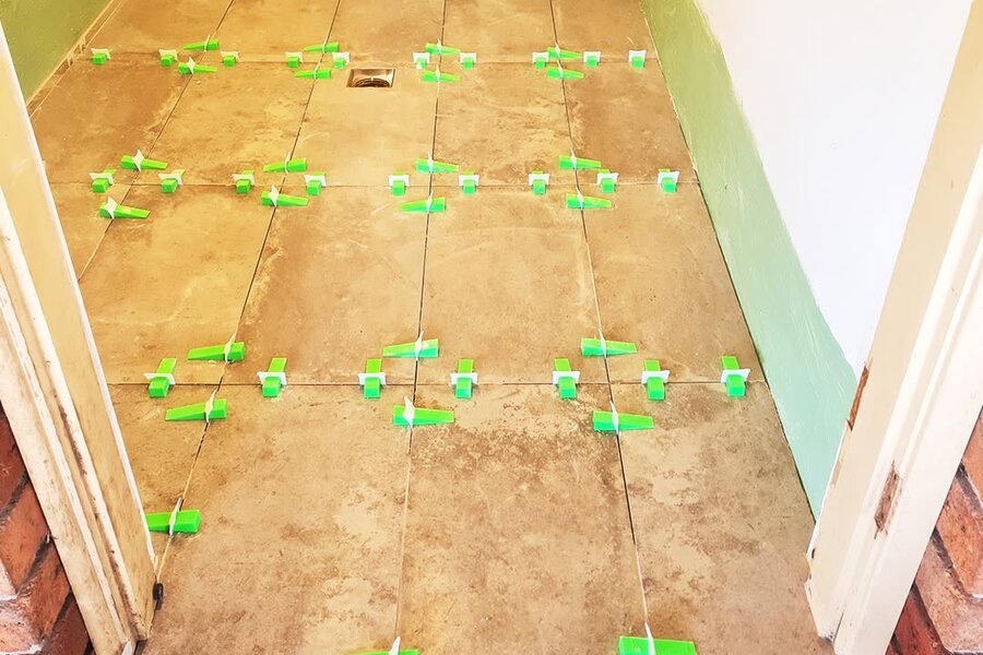 Laundry floor tiles laid with 1.5mm self-levelling spacers by SLJ Express Tiling